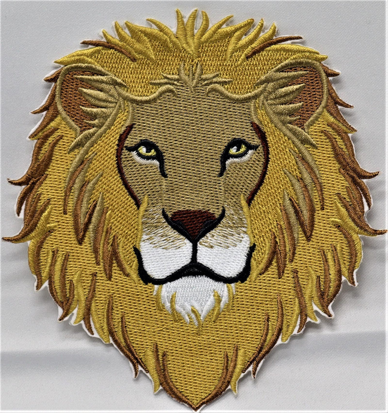 Embroidered patch of a lion's head on a gray background