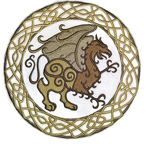 Embroidered design of a winged creature in a circular pattern with intricate designs.