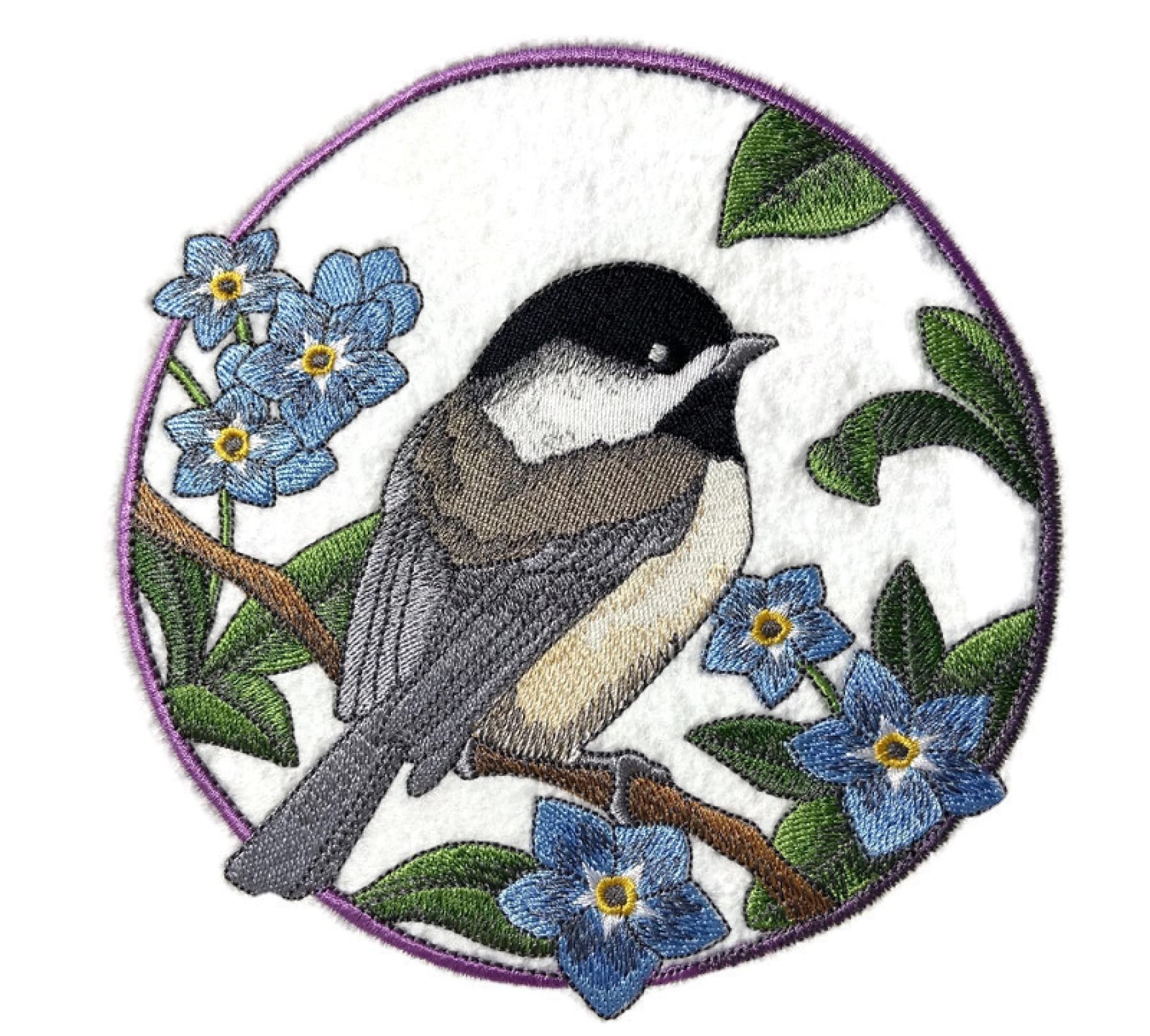 Embroidered design of a bird and flowers in a circular frame on a white background