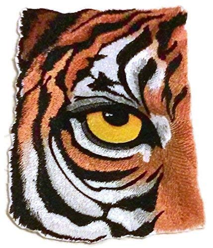 Embroidered patch of a tiger's face with a close-up of an eye on a white background