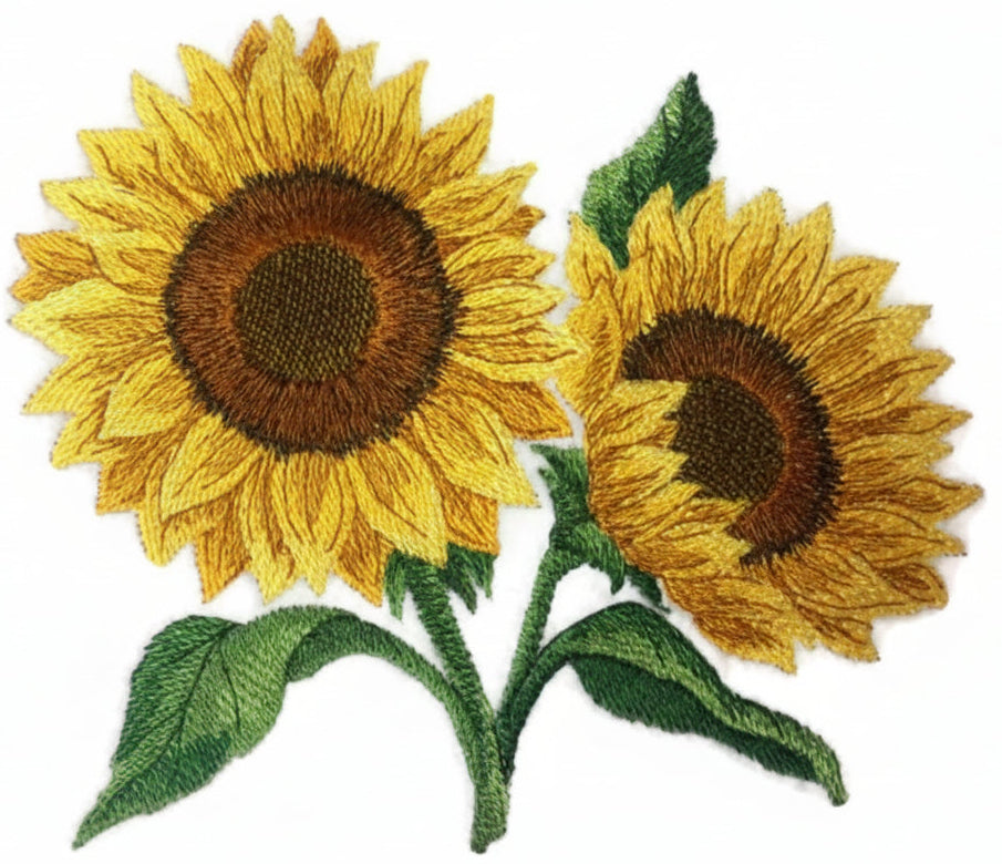 Two embroidered sunflower patches on a white background