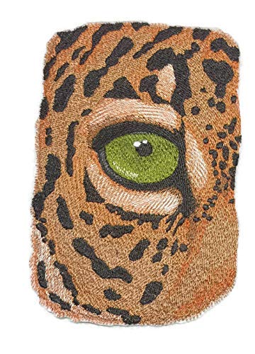 Doormat with a leopard print design featuring a green eye.