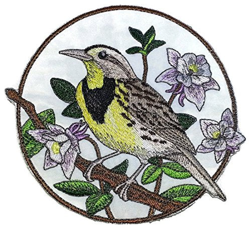 Embroidered patch of a bird on a branch with flowers