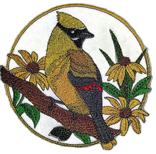 Embroidered patch of a bird on a branch with flowers